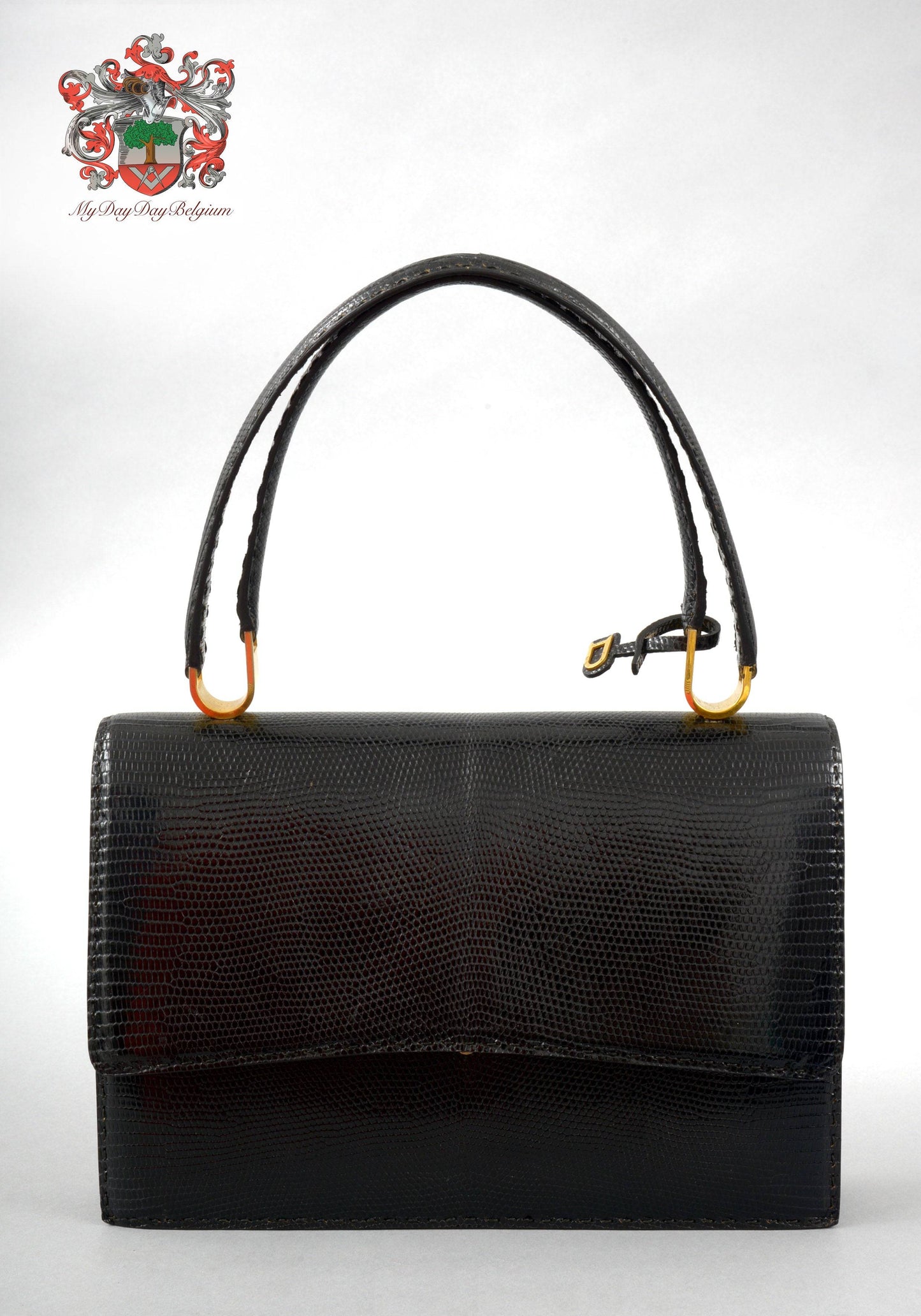 Delvaux vintage top handle handbag in lizard leather 1974