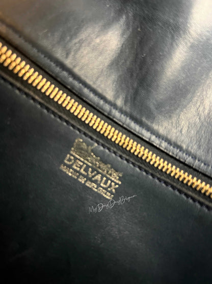 Alt text: "Blue ceramic coffee mug with embossed logo, 12 oz capacity."