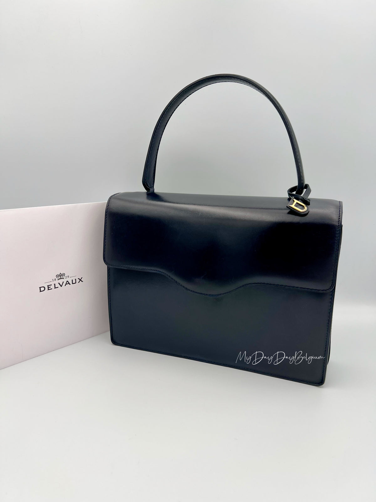Vintage Delvaux top handle box calf 1967 navy