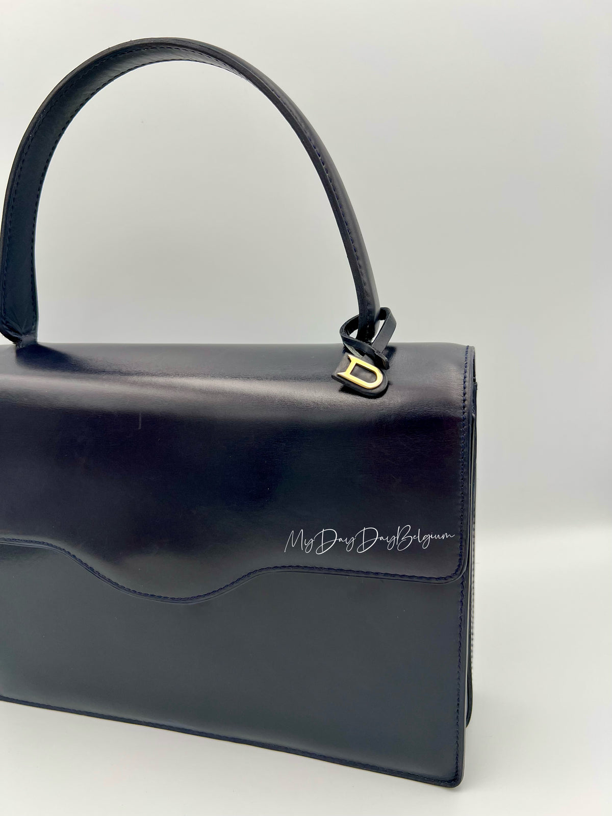 Vintage Delvaux top handle box calf 1967 navy